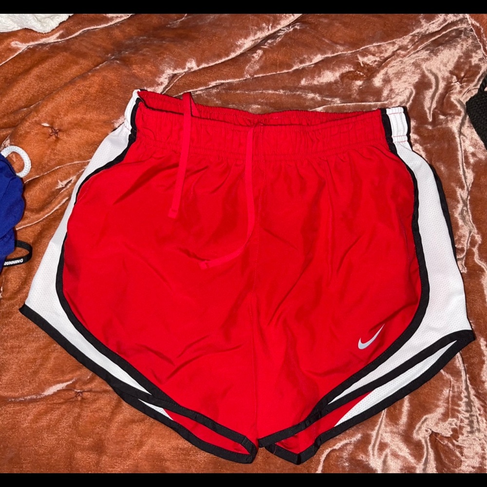 Red Nike running shorts